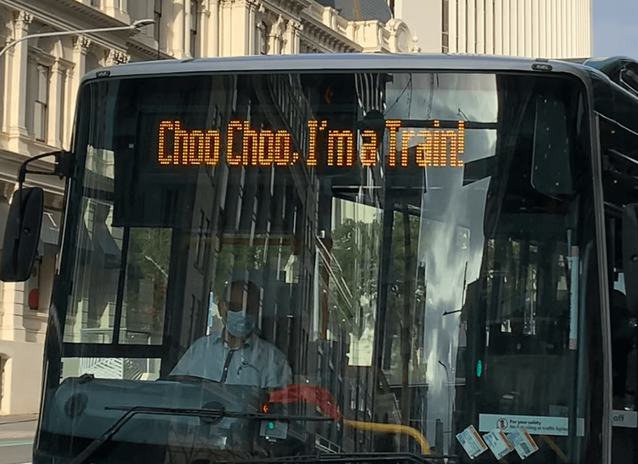 A bus with a digital display that says Choo Choo, I'm a Train!