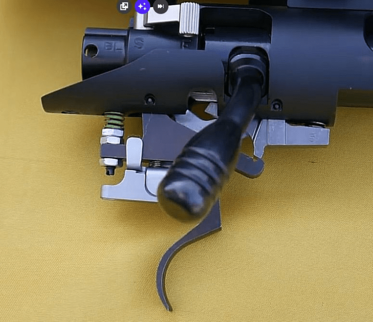 Installation of a reduced power trigger spring in T/C Compass rifle.