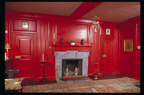 Historic red parlor with fireplace and period furnishings at Sotterley Plantation, Maryland colonial home