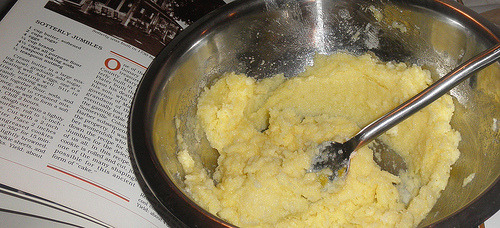 Homemade cookie dough being mixed in bowl with spoon, Sotterley Jumbles recipe preparation