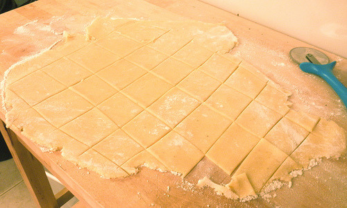 Homemade shortbread dough cut into squares on parchment paper, ready for baking classic Maryland Sotterley Jumbles cookies