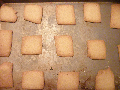 Golden-baked butter cookies cooling on parchment paper, classic Sotterley Jumbles from Maryland cookbook recipe