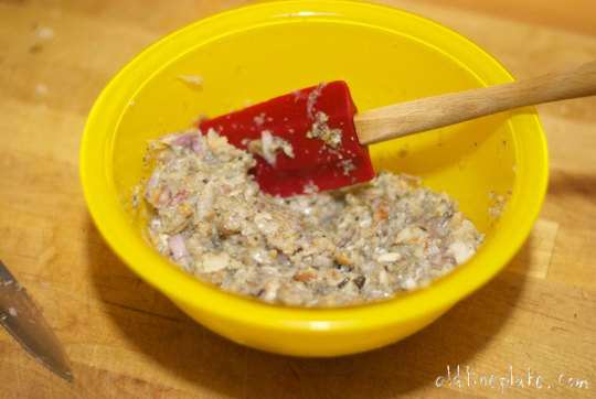 mixture in yellow bowl with red spatula for Beef à la Mode recipe