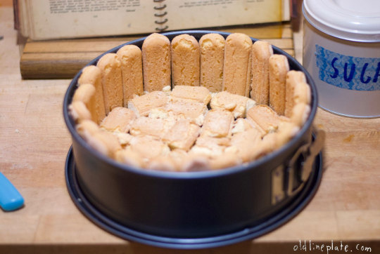 Homemade pineapple icebox cake with ladyfinger cookies lining springform pan 