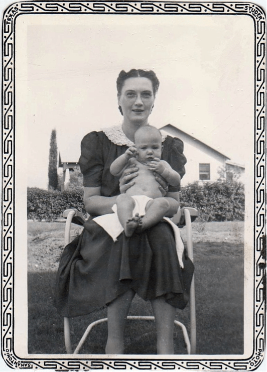 Judy Lites (later Wills) bBeing held by her Mother
