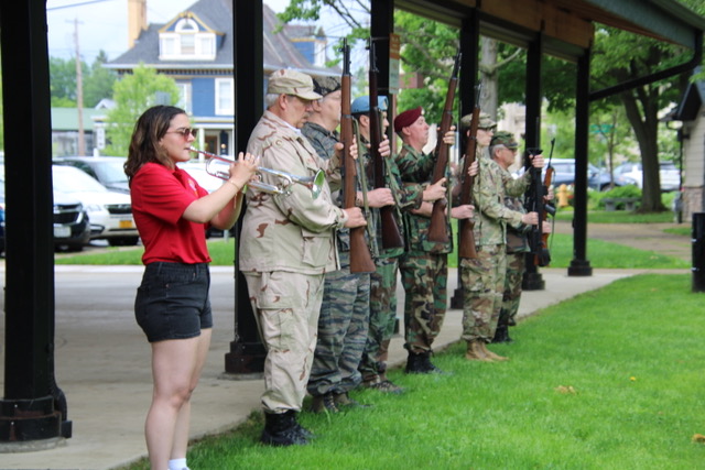 (Rick Miller/Olean Star) A member of the Olean High School Band plays taps after a 21-gun salute by the American Legion Post 530 Honor Guard ay Memorial Day ceremonies Monday at Lincoln Park.