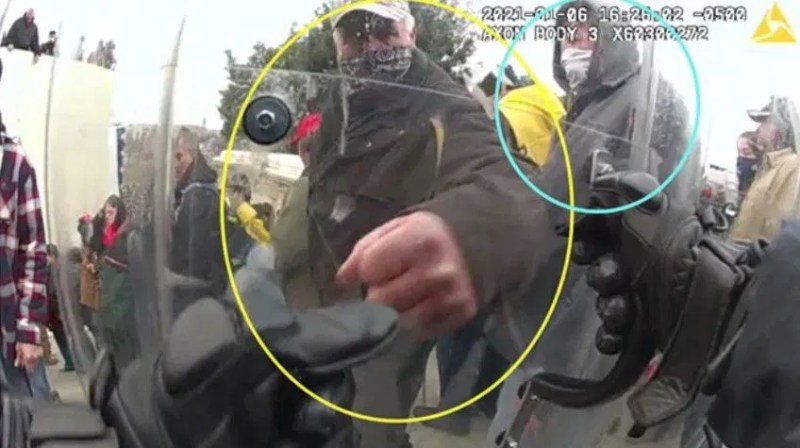 Screenshot of body worn camera showing Tighe Scott hitting Officer S.G.’s shield (United States Department of Justice).jpg