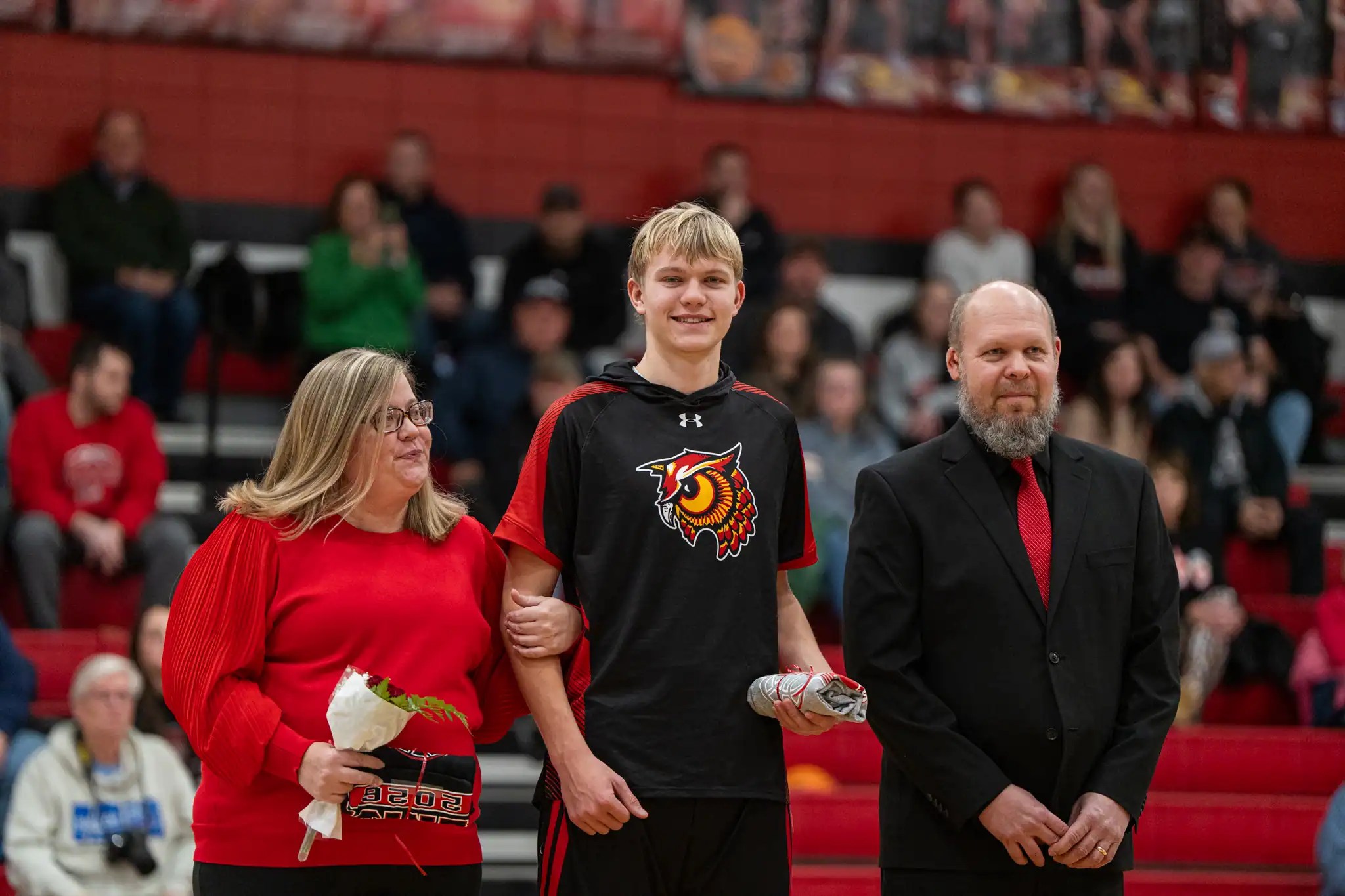 First year head coach Andrew Terwilliger (far right) stands with his son and player, Marcus, during Bradford's Senior Night on Thursday, Jan. 29. | Photo by Hunter O. Lyle