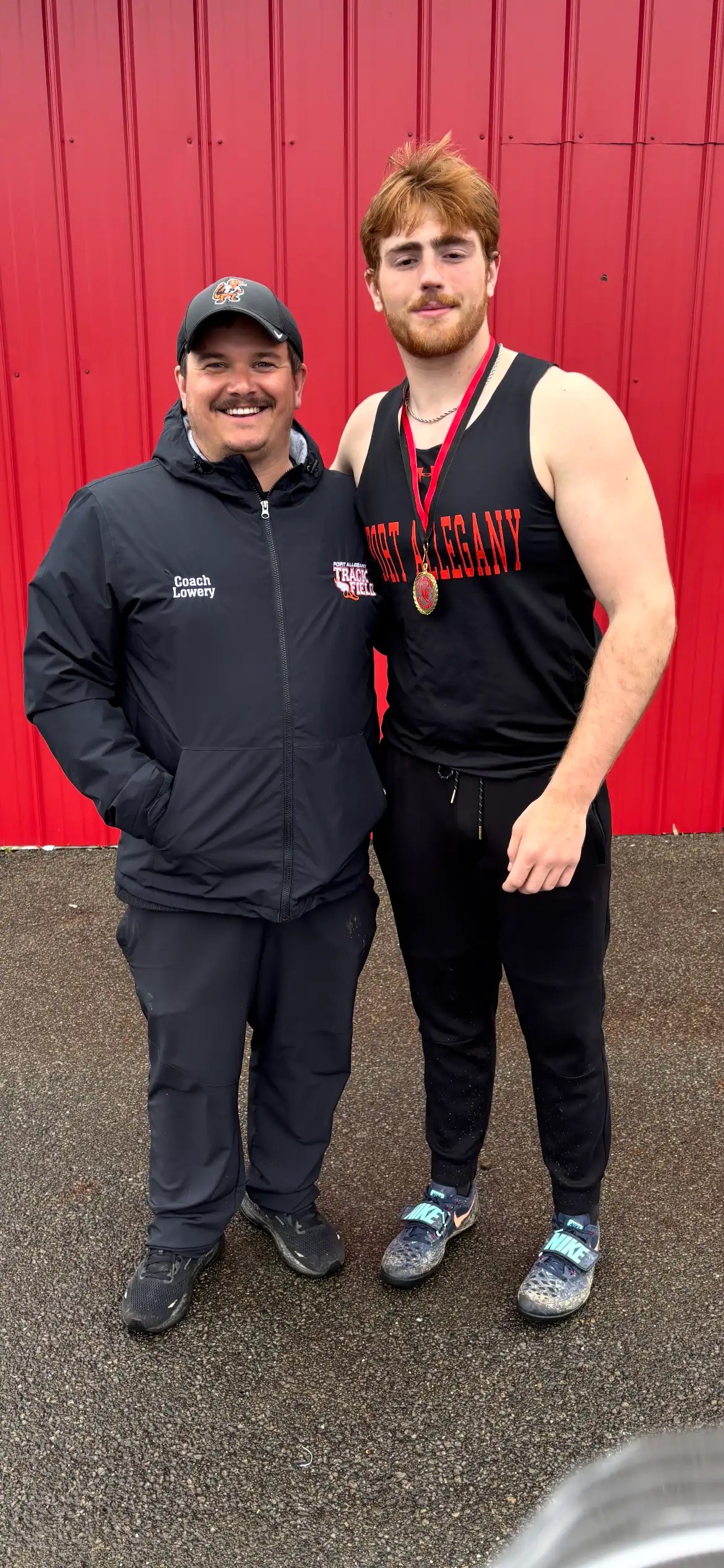 Port Allegany track and field coach Seth Lowery and Ethan Tarbox pose at the Franklin Invitational on Saturday, April 25. At the meet, Tarbox broke a 48-year-old discus record. | Photo submitted