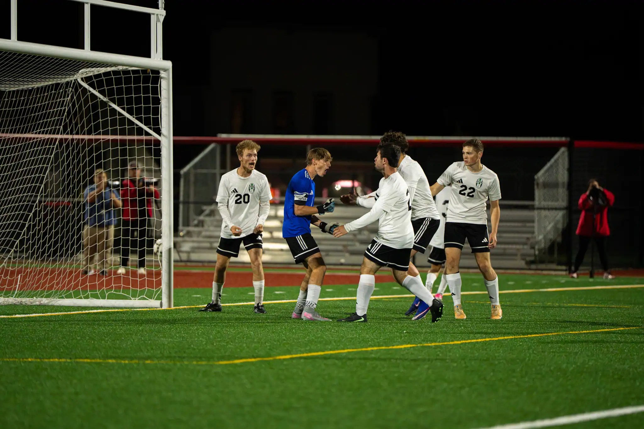 The Allegany-Limestone boy's soccer team celebrate after Donovan Booker's shutout-saving penalty kick save during their win against Olean. | Photo by Hunter O. Lyle