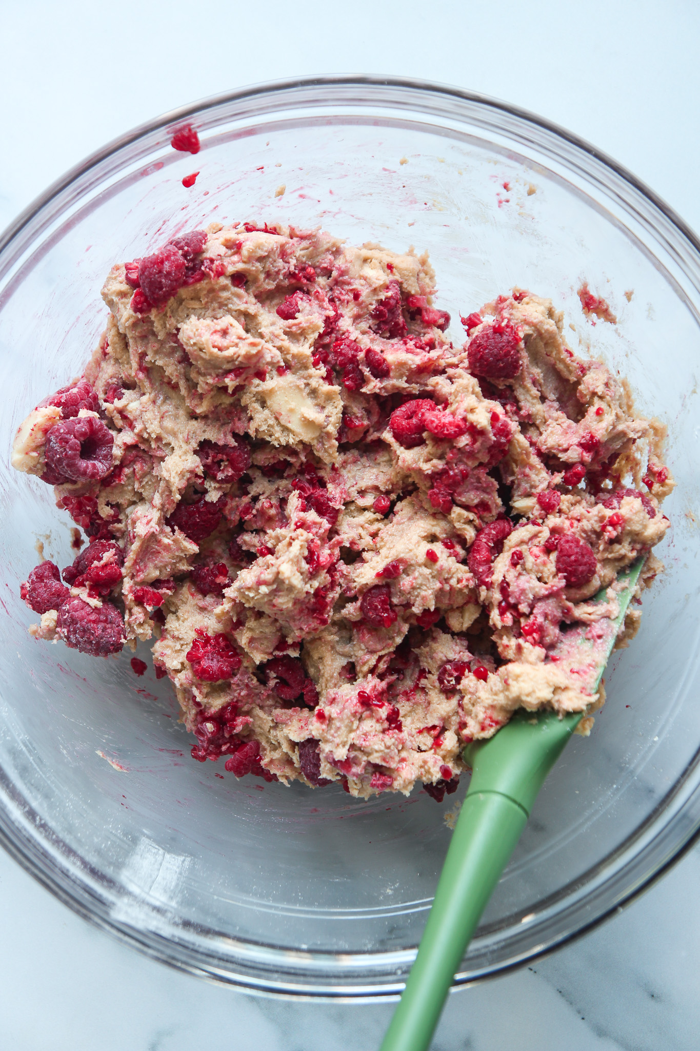 White chocolate & raspberry cookie dough in a mixing bowl.