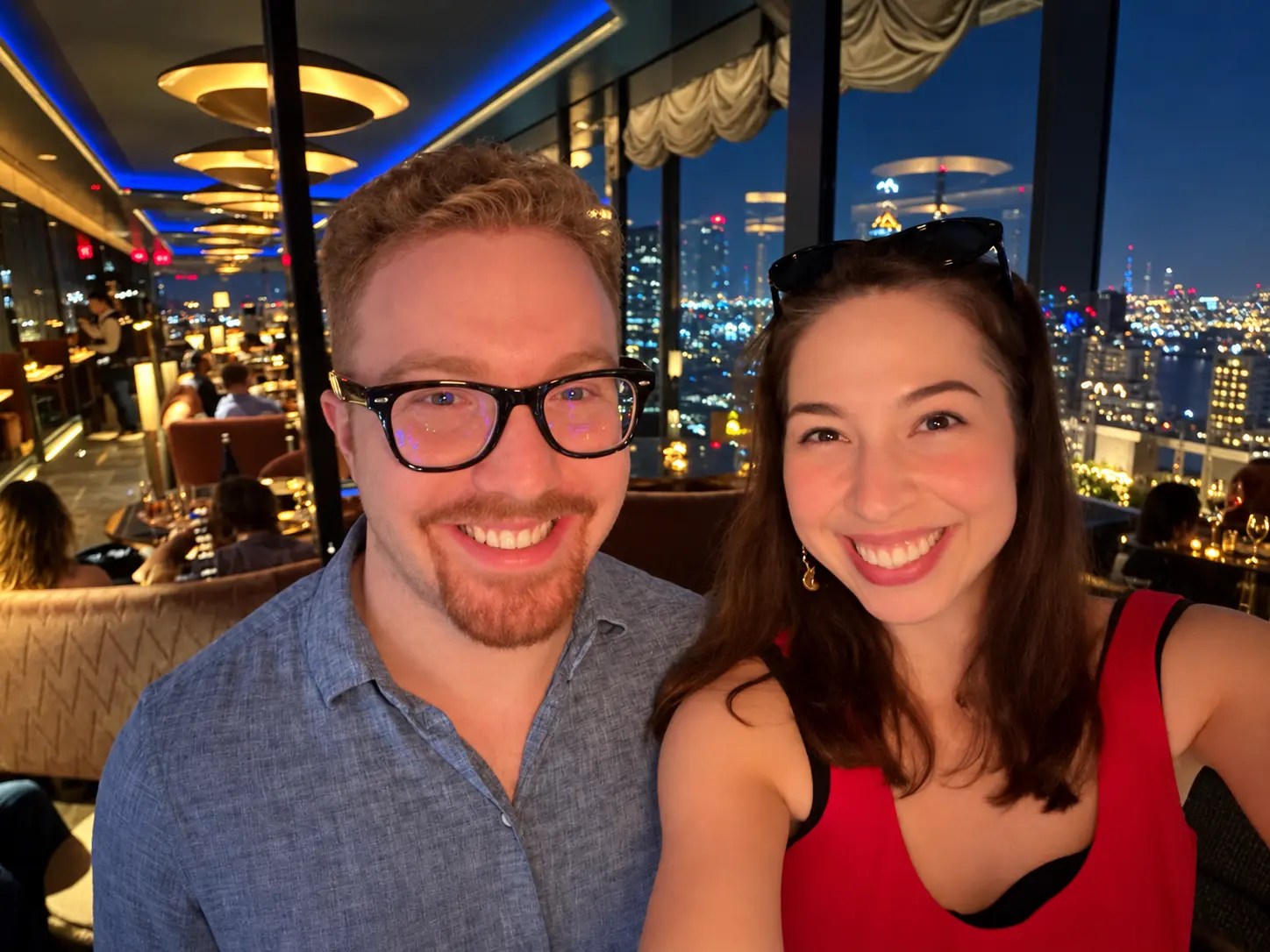 Olivia Gallucci and James at a rooftop restaurant