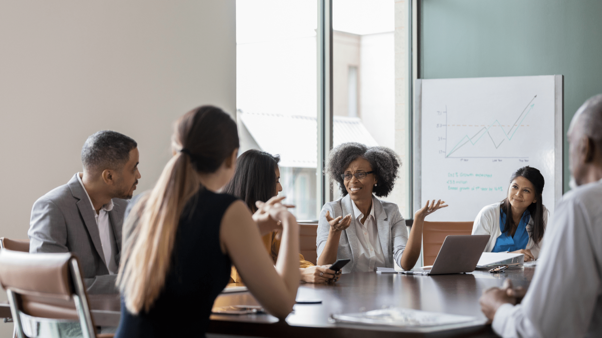 Nonprofit professionals working with their fundraising CRM and coming up with fundraising goals
