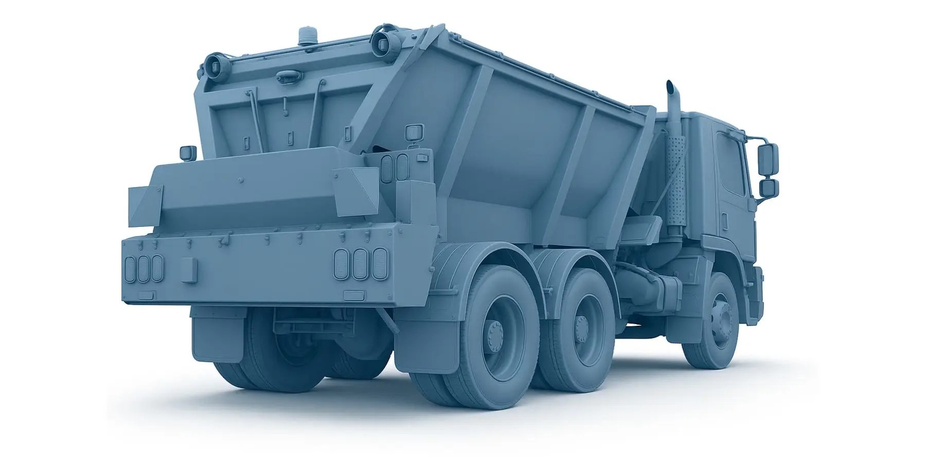 Rear view of a blue chip spreader truck used for evenly distributing aggregate over road surfaces. The truck features a large hopper, dual rear axles, and spreading equipment at the back, depicted on a white background.
