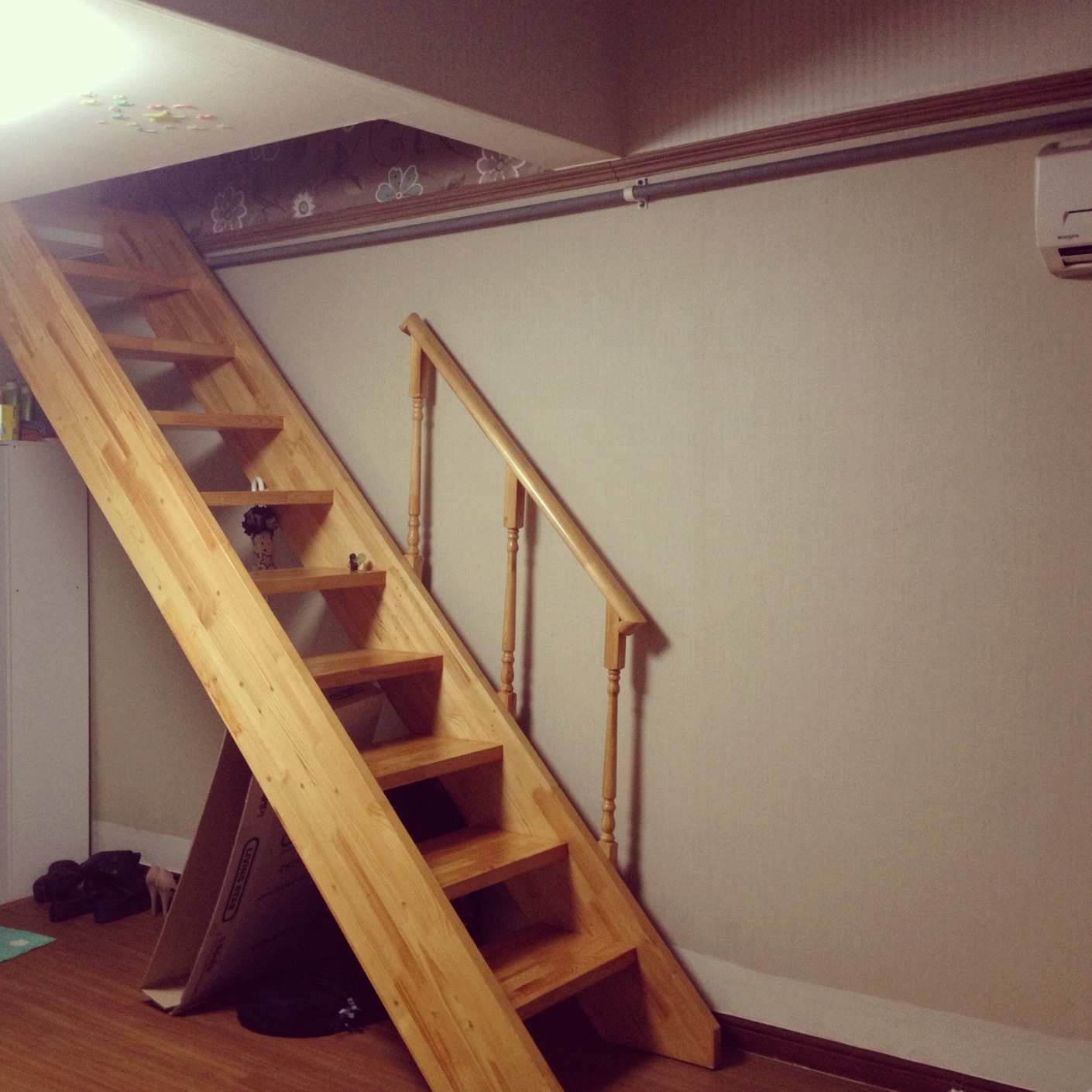 Stairs leading up to bedroom loft.