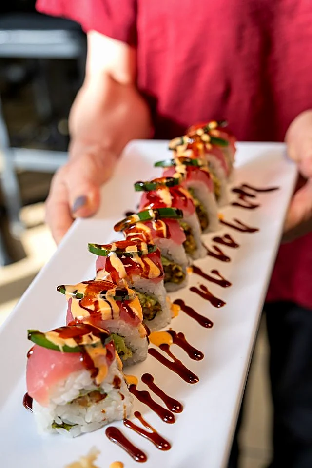 Ace Roll topped with tuna, jalapeno, and special spicy sauce