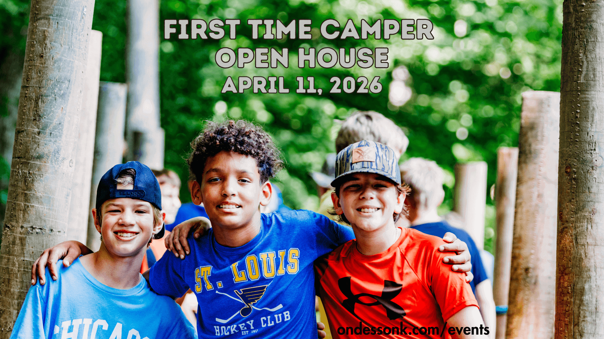 Three boys smiling at summer camp event.