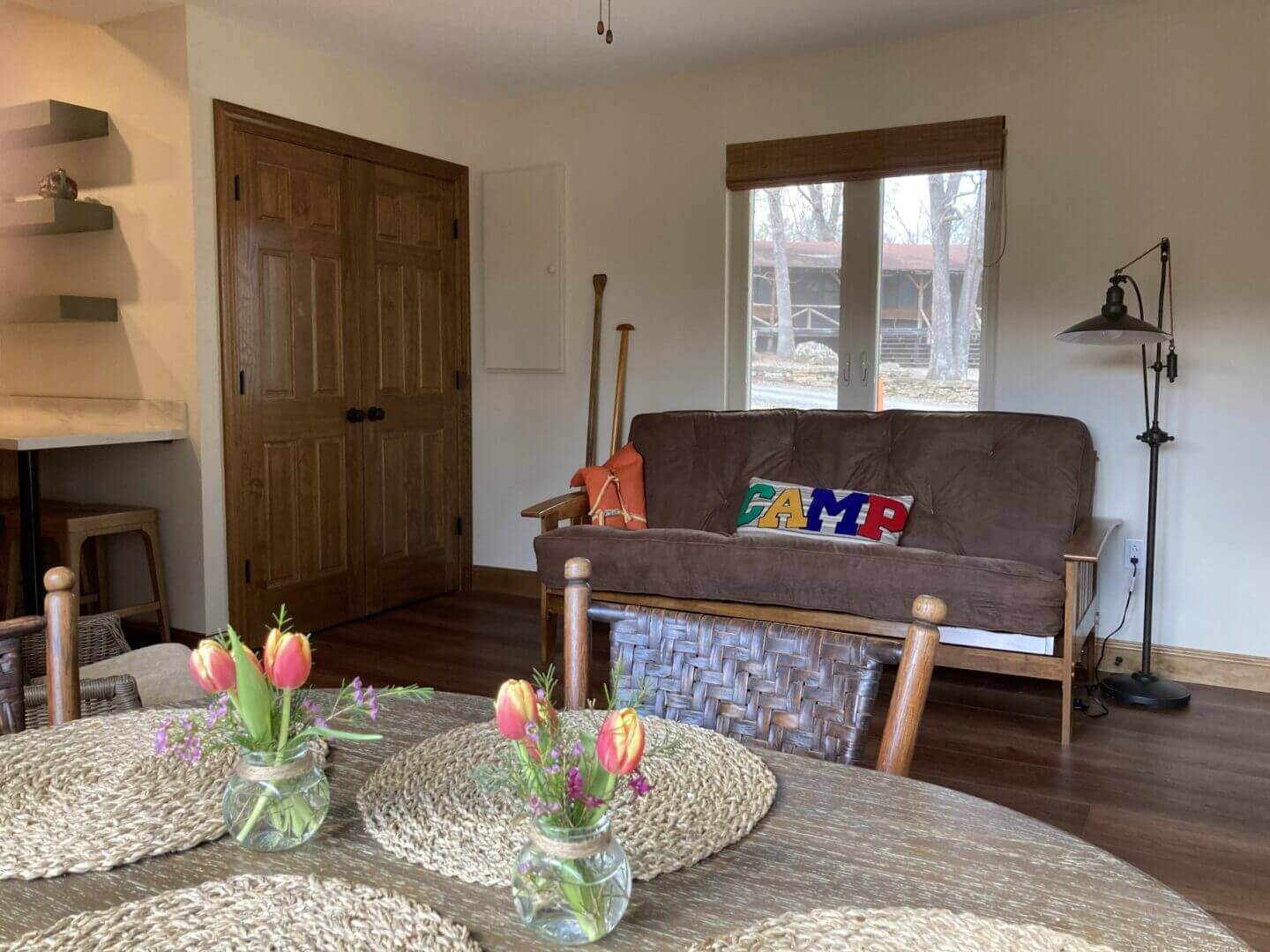 A living room with a table and chairs.