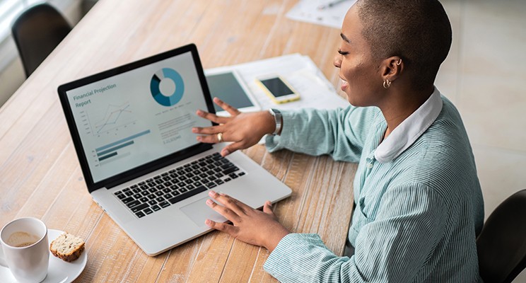 person on a computer looking at a presentation