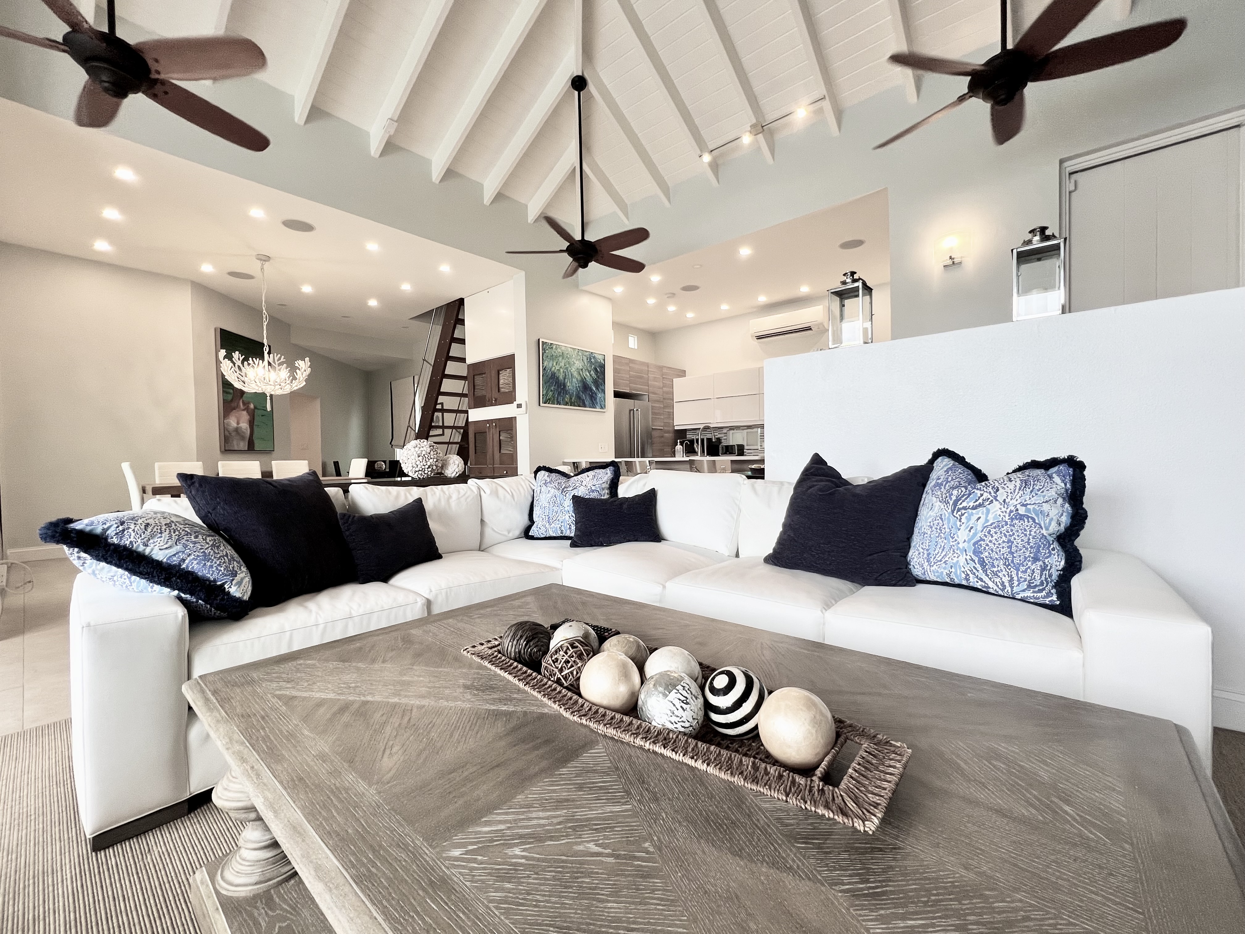 Sunken living room with large smart tv