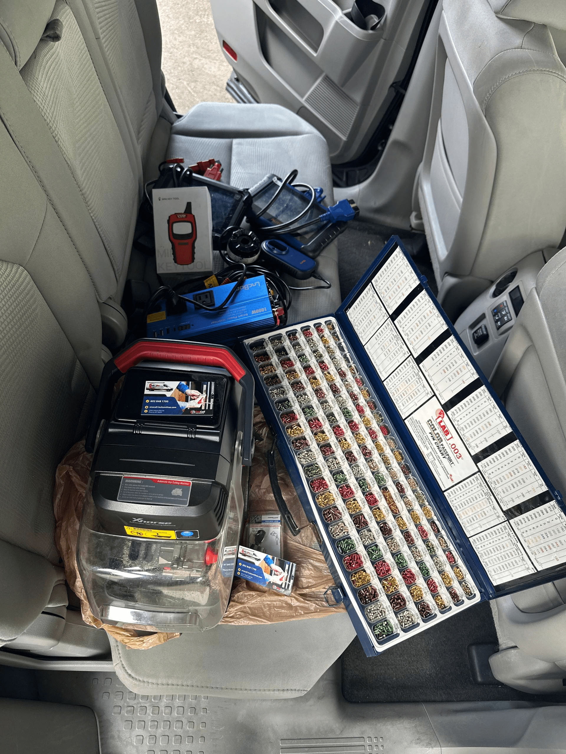 Locksmith tools and key machine with business card