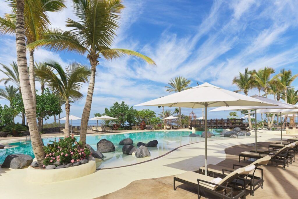 Lagoon-style pool with palm trees at the Ritz-Carlton, Abama