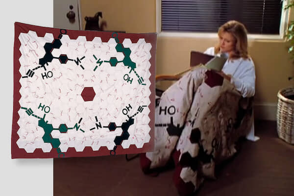 A Melrose Place character wearing a blanket containing the chemical structure of RU-486