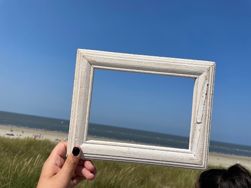 Picture of empty frame against a beach backdrop.