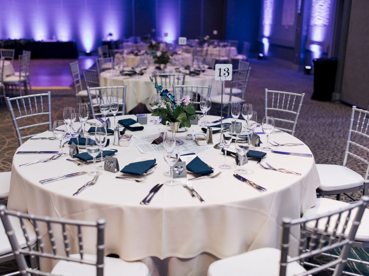 Empty banquet table with complete place settings.