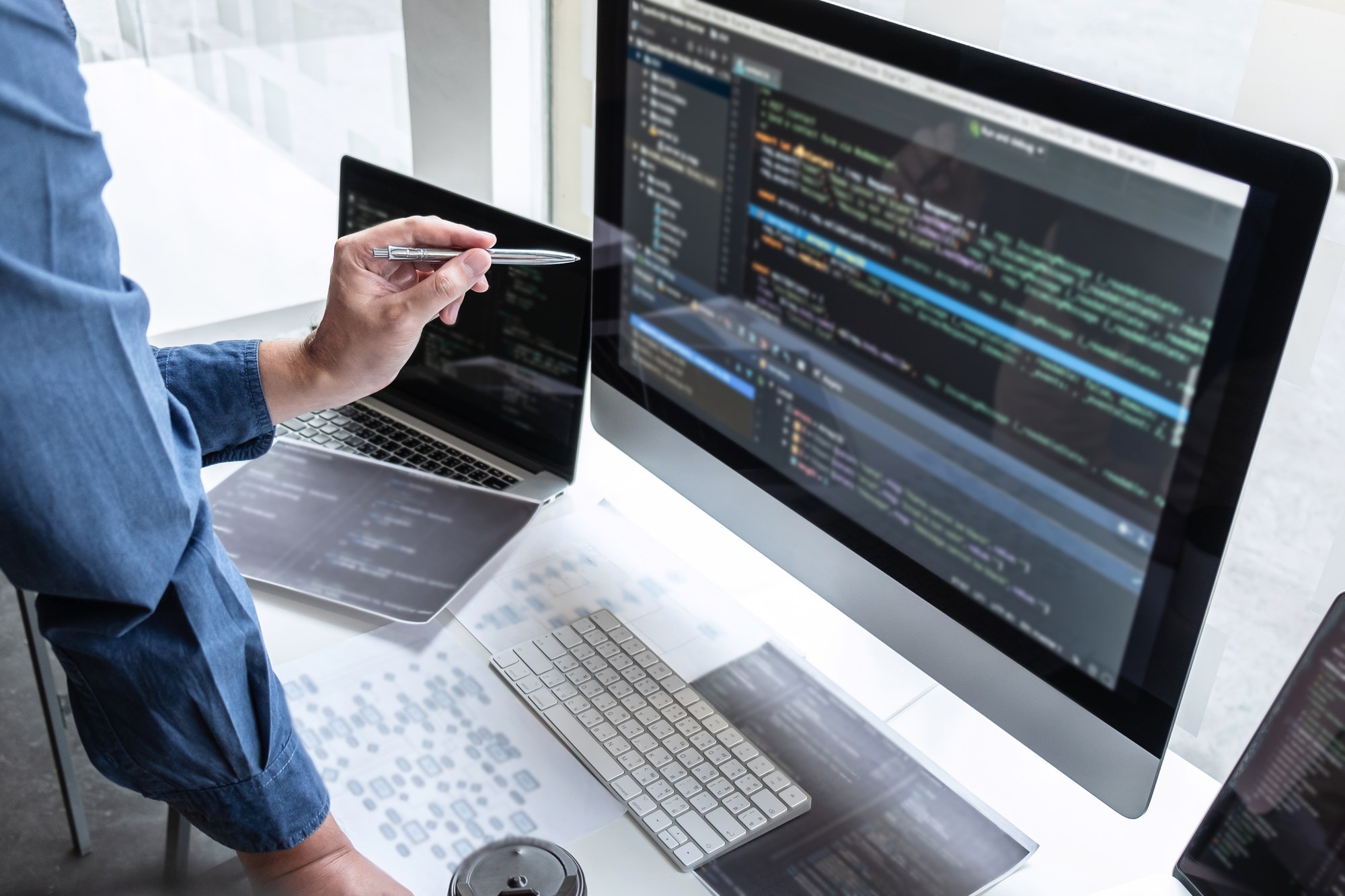 Developer programmer working on project in software development computer in IT company office Developer programmer working on project in software development computer in IT company office