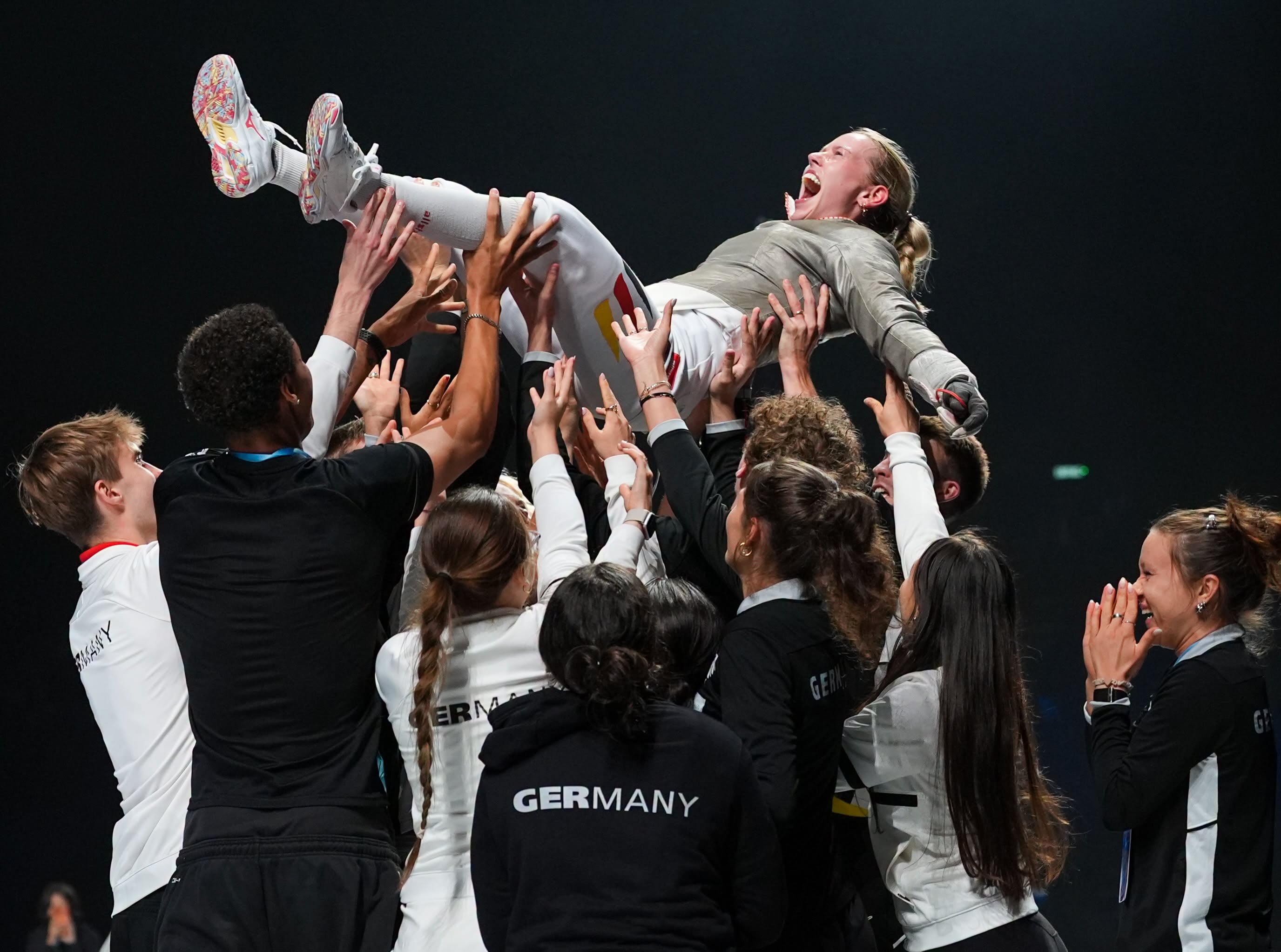 Larissa Eifler screaming in pure joy and celebrating her historic women's sabre gold medal victory:Photo from Deutscher Fechter-Bund wall