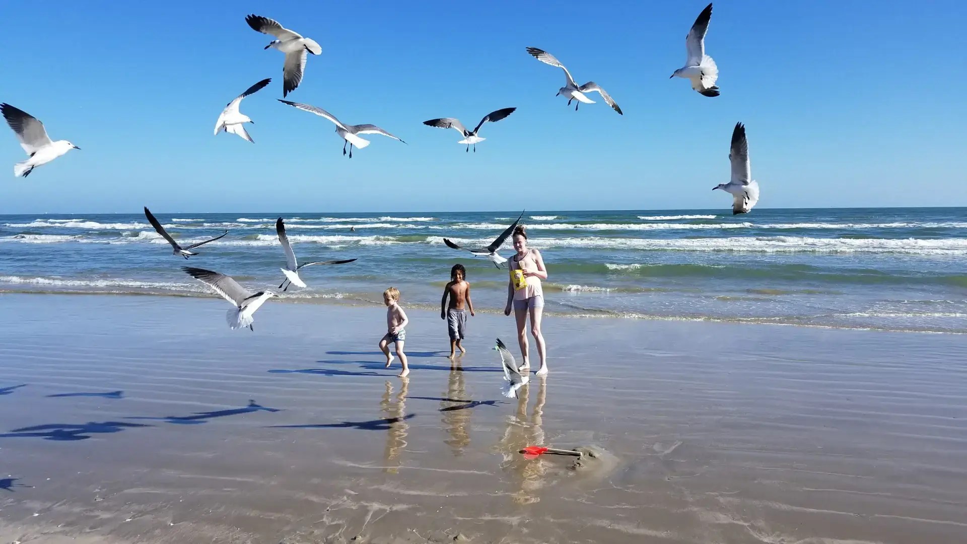 family playing on beach in port aransas