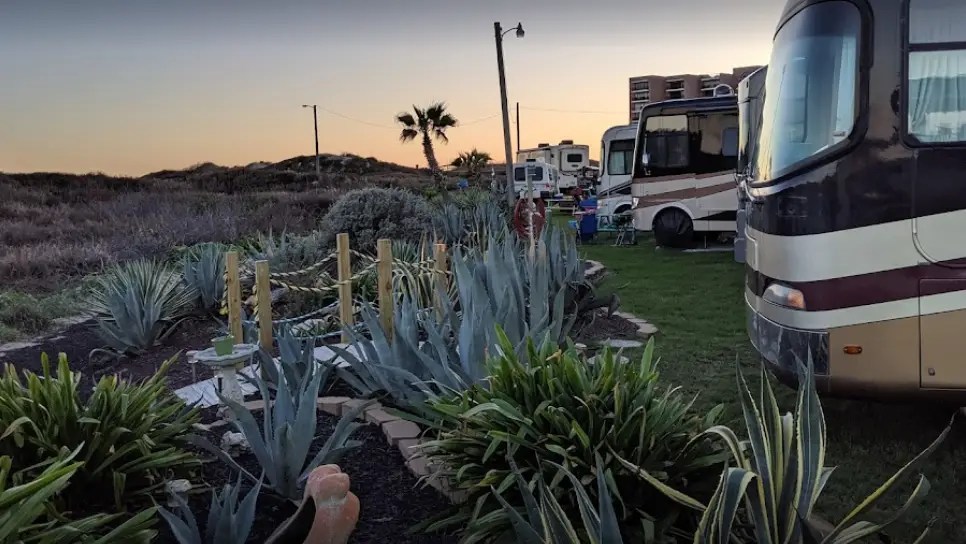beachfront RV sites at on the beach rv park with landscaping and sand dunes