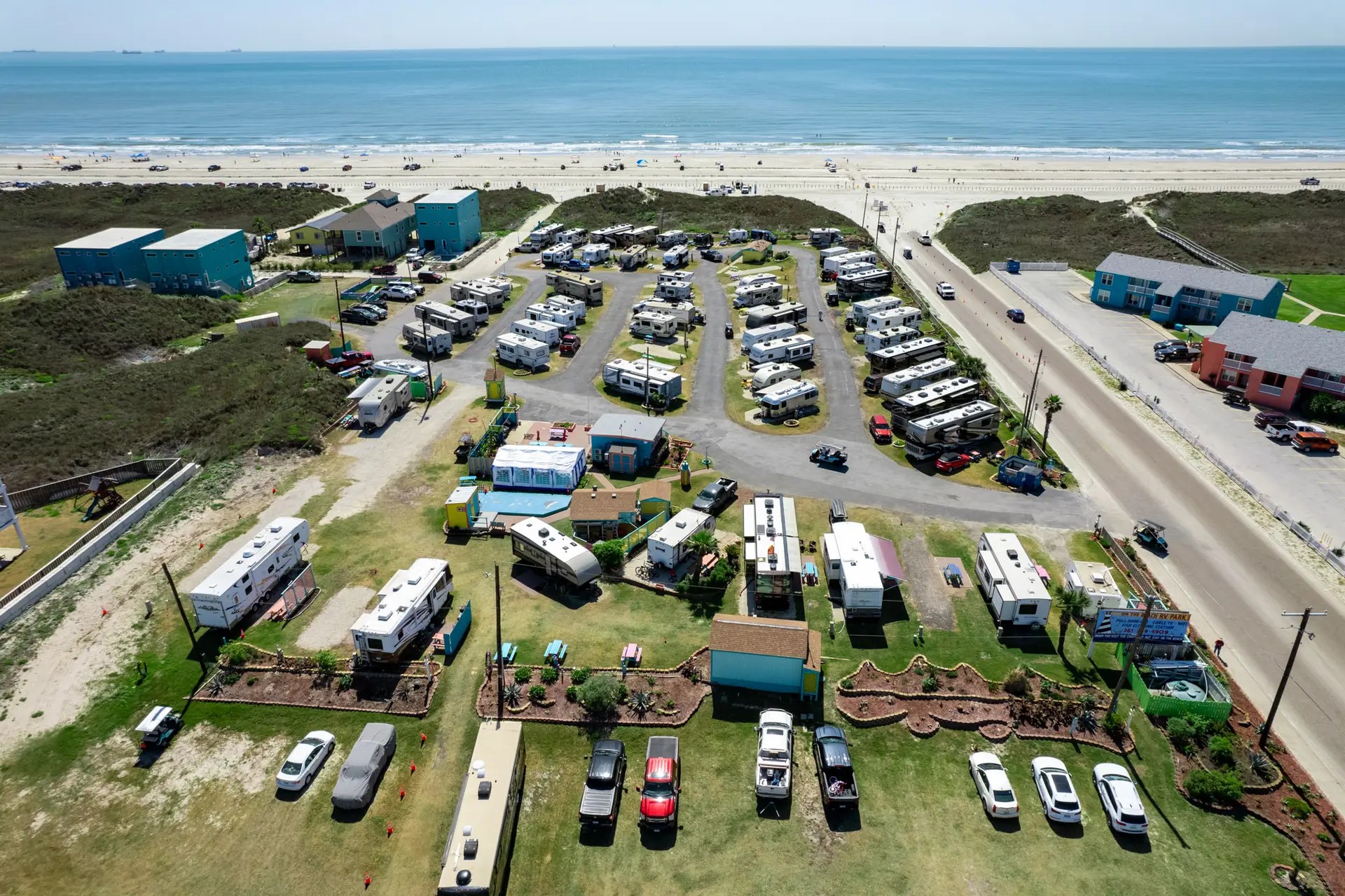 Aerial of on the beach rv park with beach and ocean in background