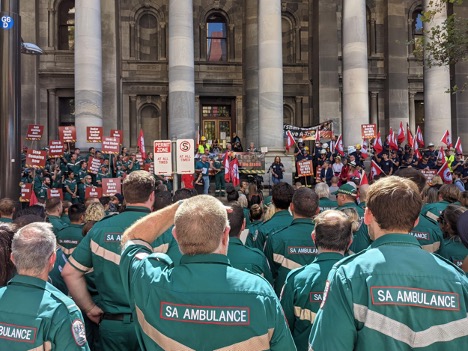 Firefighters, paramedics gather outside Parliament House in emergency service funding union rally