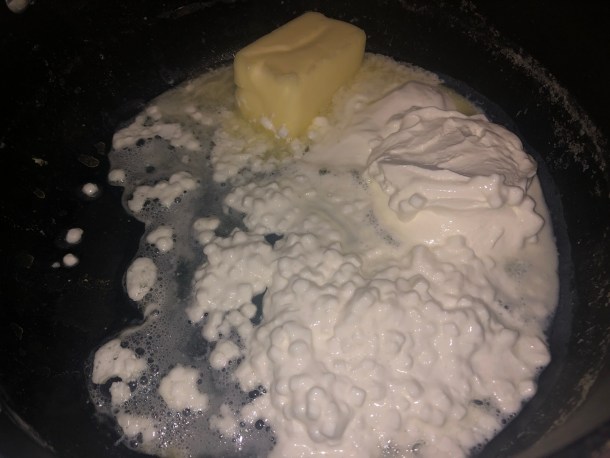 Adding in cottage cheese, sour cream, and butter.