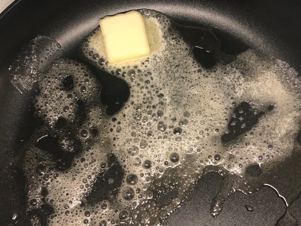 Letting olive oil and butter melt.