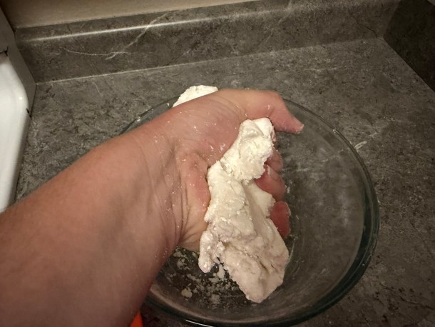 Cooking Eorzea | Mashing the dough together.