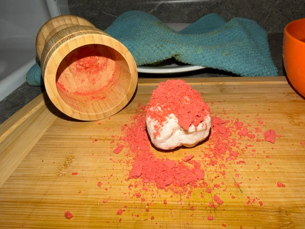 Cooking Eorzea | Dumping the ground strawberries on top of a dough ball.
