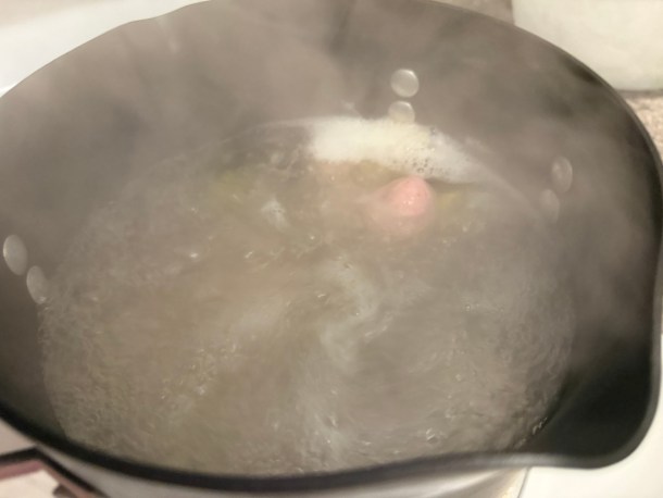 Floating dough balls in boiling water.