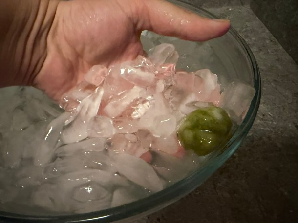 Removing dango balls from the ice water.