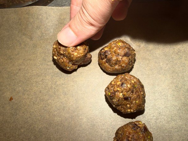 Placing the ball onto the parchment paper.