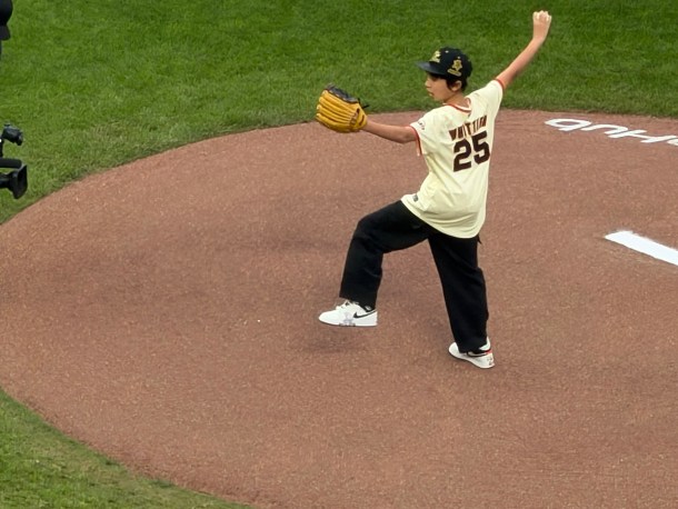 Junior Pokémon Championship Worlds VGC champion Luke Whittier throwing the ceremonial first pitch.