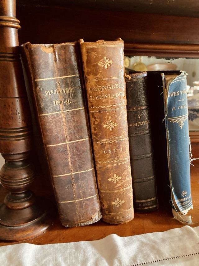 Close-up of worn Welsh-language books in a Rhyd-y-car cottage