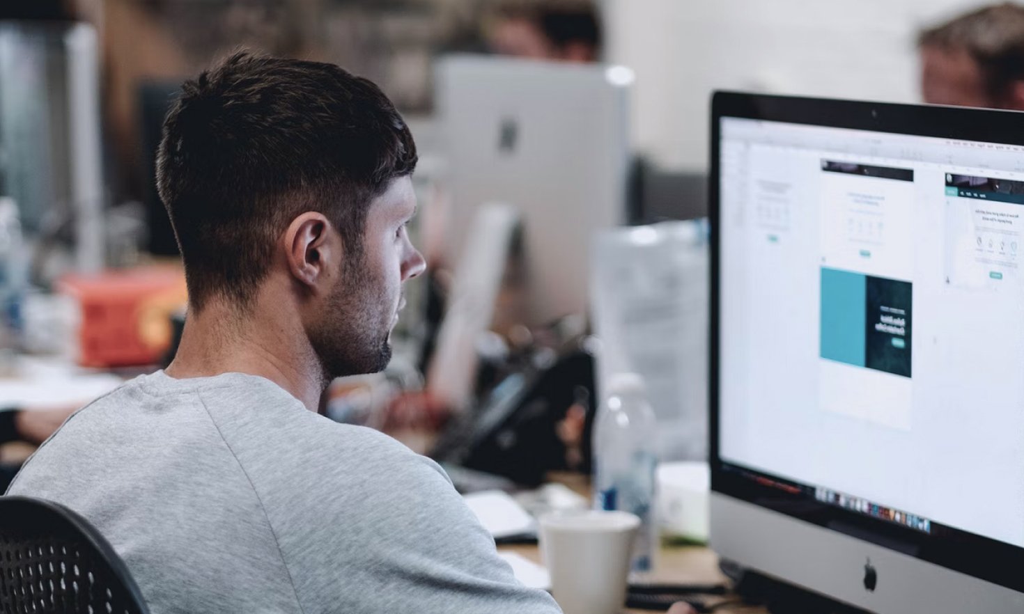 Negative Content Removal Experts at OptimizeUp working on Computer