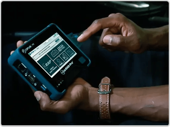 CarDAQ-Pro in a technician's hand