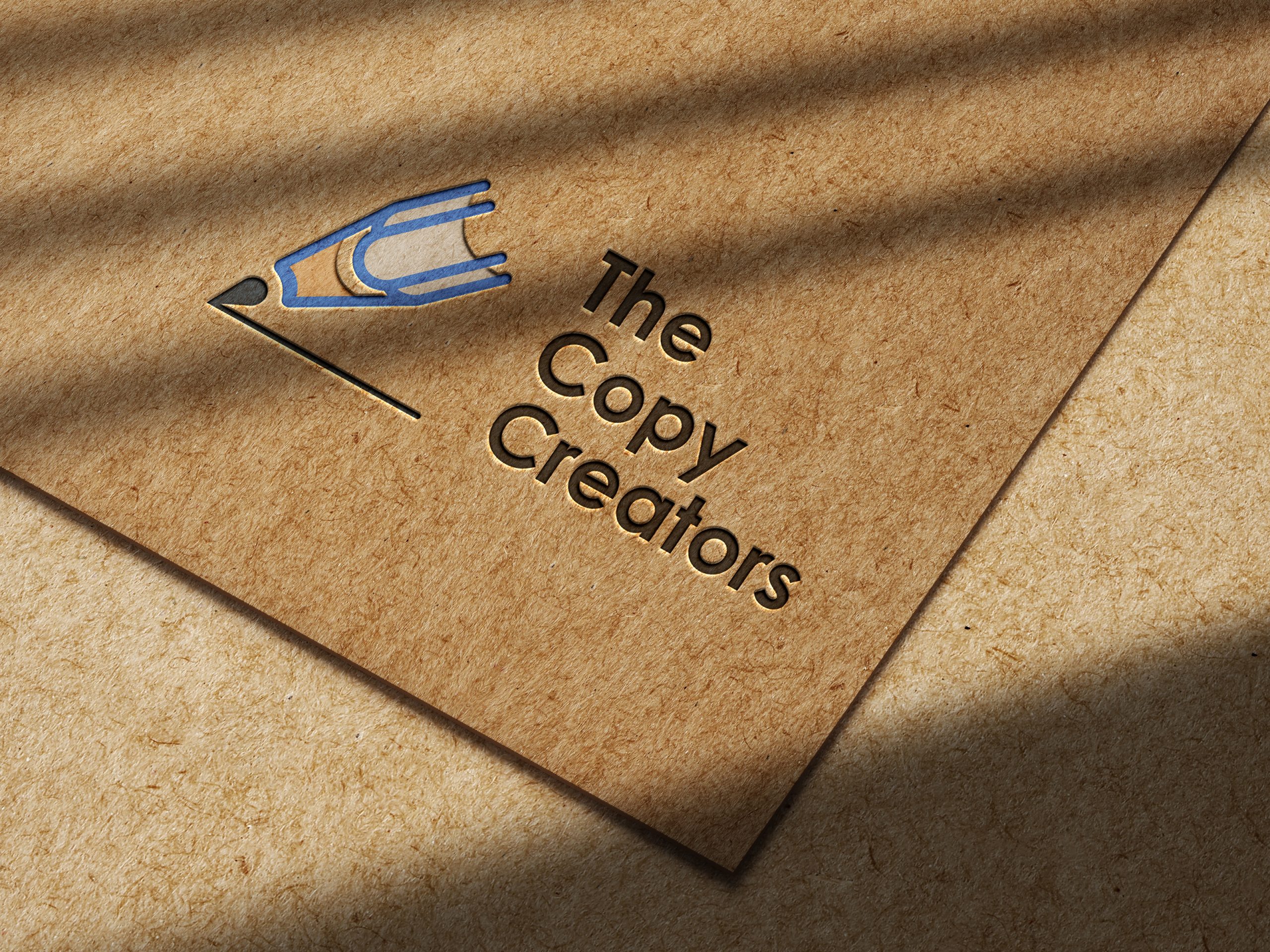 "The Copy Creators" logo embossed on textured paper.