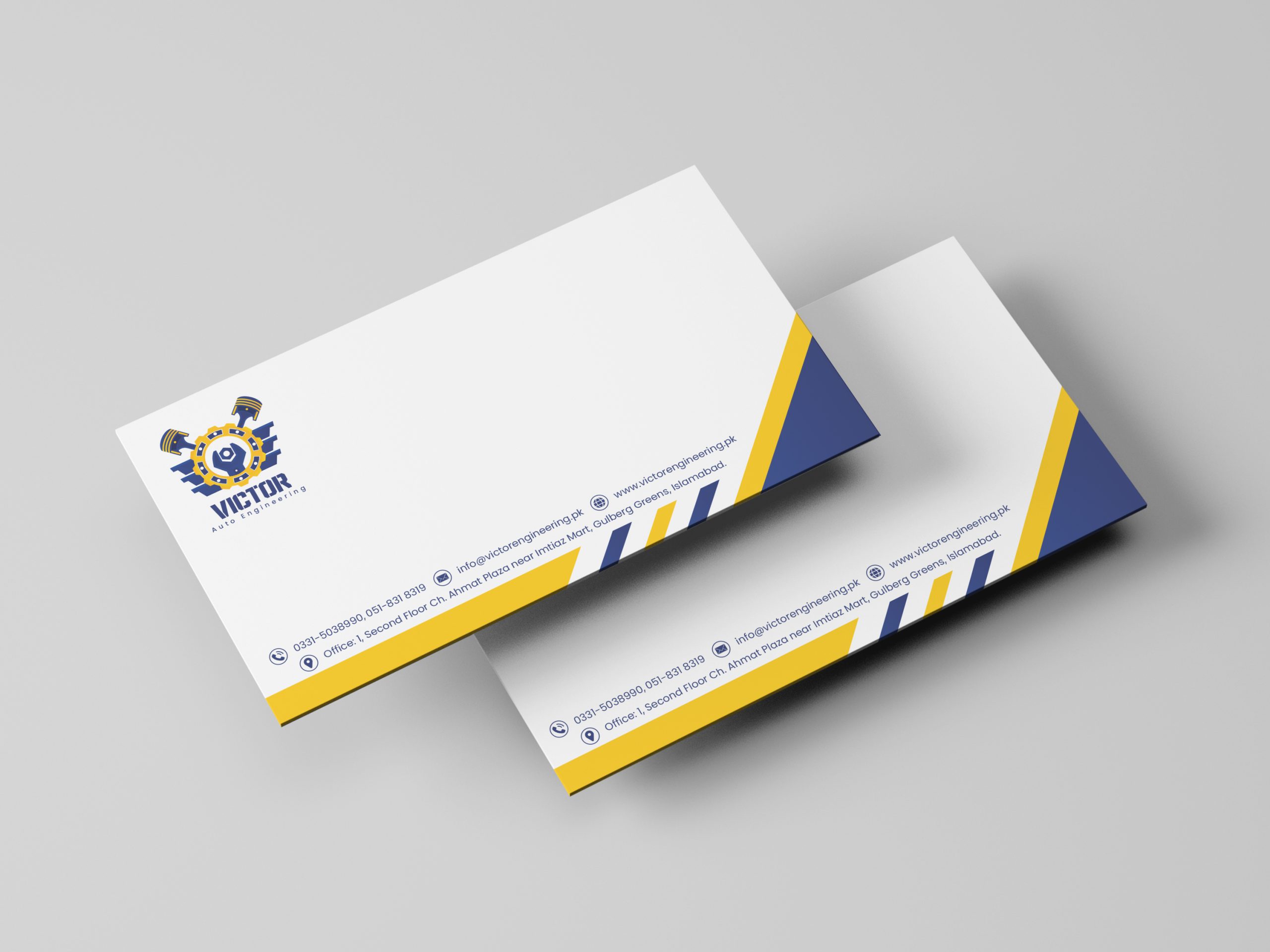 Two business cards for "Victor Auto Engineering" with a logo featuring gears and pistons, contact information, and a blue and yellow diagonal design.