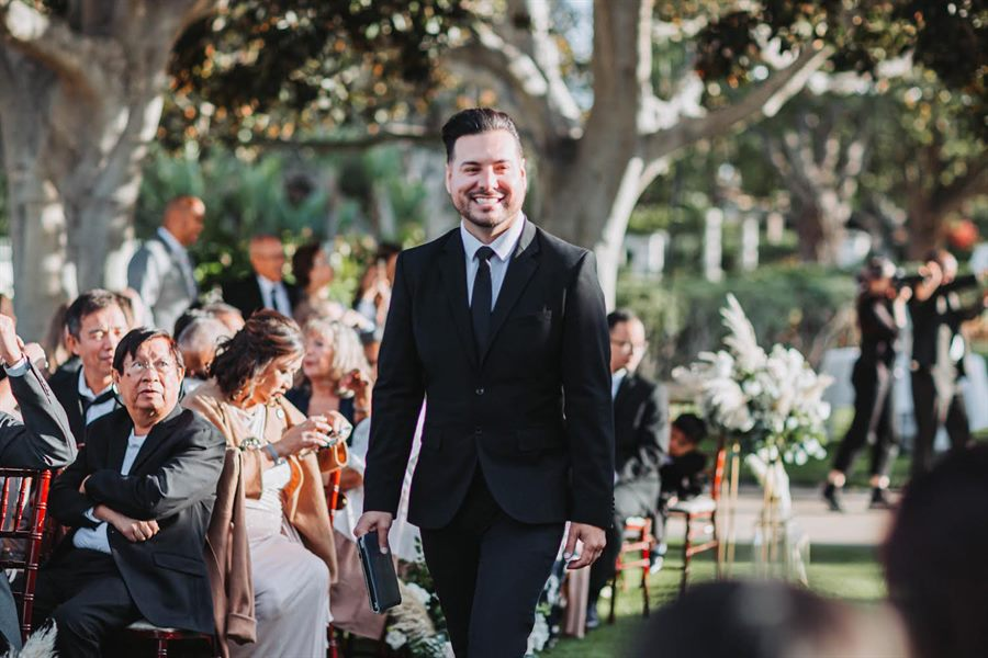 Mark arriving to officiate an outdoor wedding ceremony