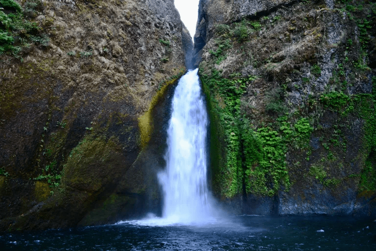 Wahclella Falls, a tiered waterfall thundering out of a narrow basalt gorge in the Columbia River Gorge near Bonneville Dam